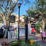 a group of people walking down a street